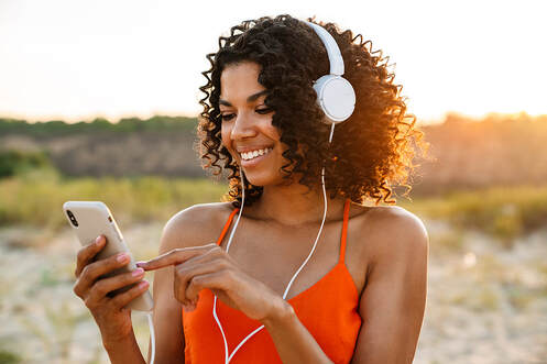 Women are Smiling and Listening To Music